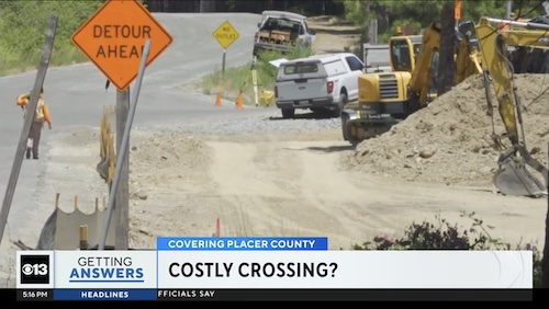 Screen grab of news report showing costly crossing chyron