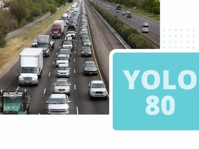 Traffic jam on a busy highway with trucks and cars, alongside a graphic label.