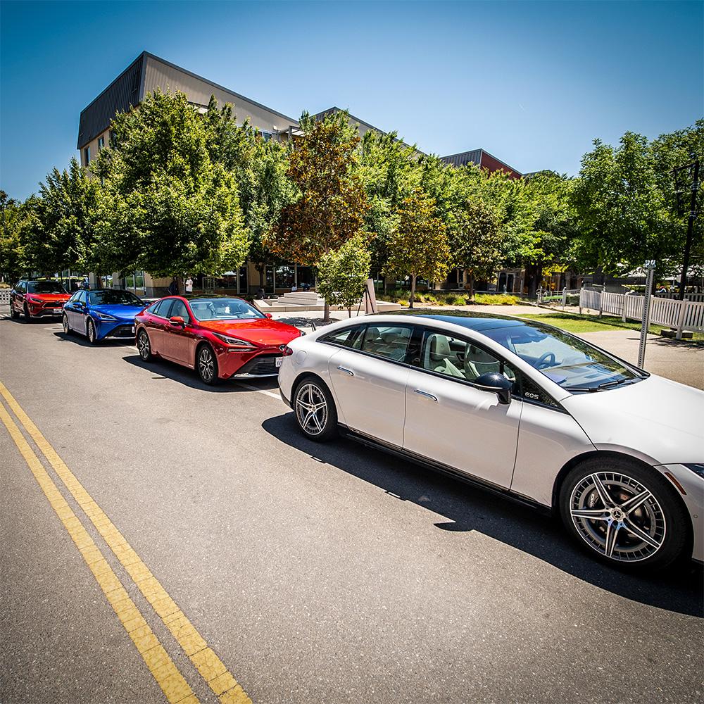 line of electric vehicles on a road